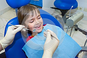 A child patient at the dentistÃ¢â¬â¢s consultation photo